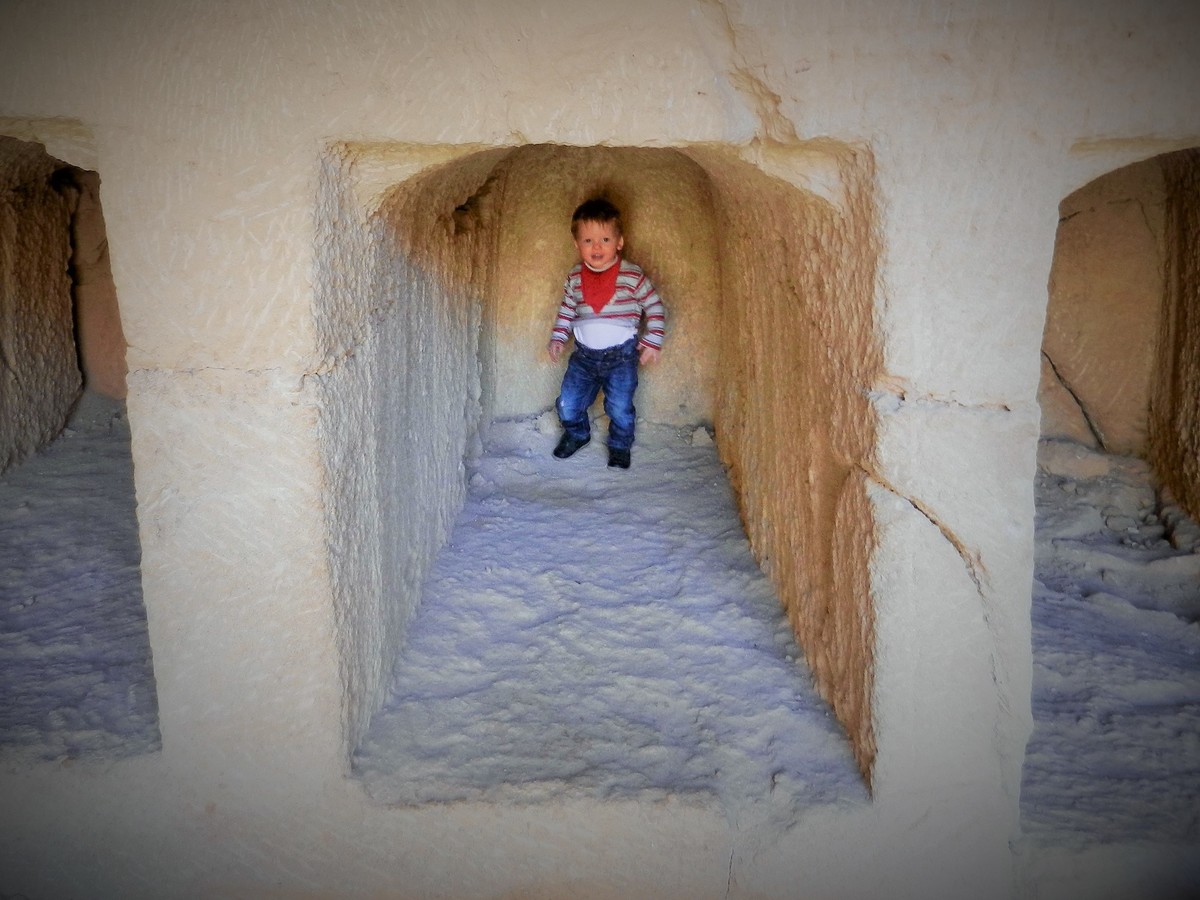 Toddler in a crypt at the Tomb of the Kings