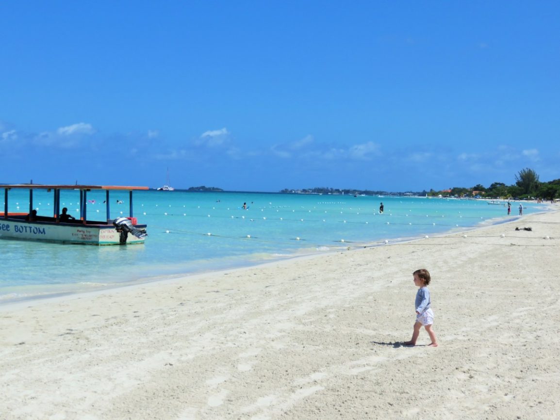 Zizi on empty beach in Negril, Jamaica