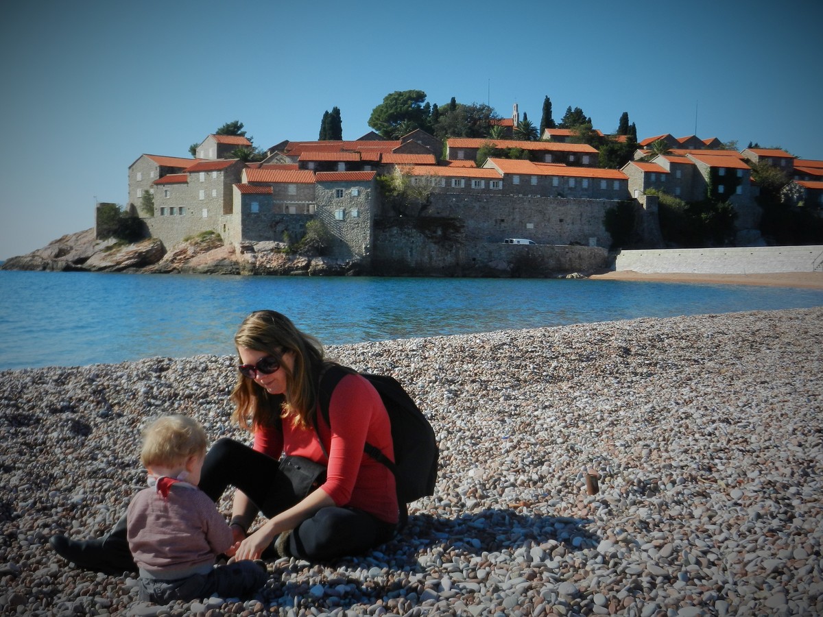 Playing on the beach with toddler H at Sveti Stefan