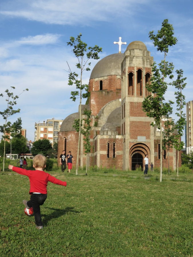 Toddler kicks football in Pristina, Kosovo