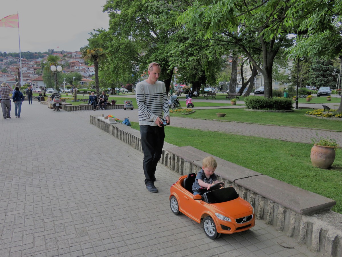 Toddler driving remote controlled car in Ohrid, Macedonia