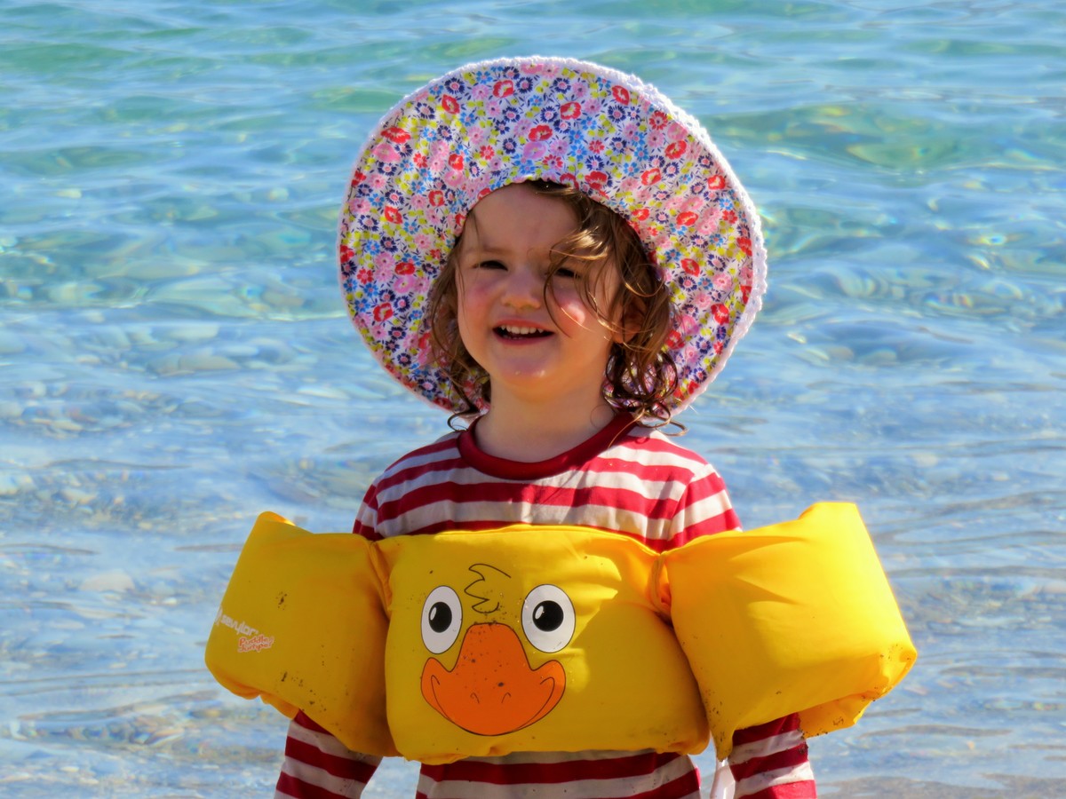 Toddler in sea at Mohlos, Crete