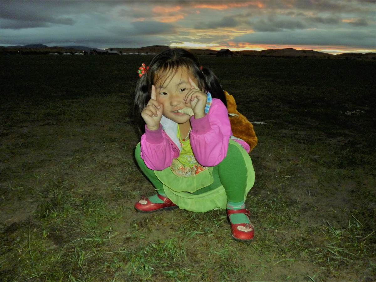 Young Mongolian girl posing for photographs.