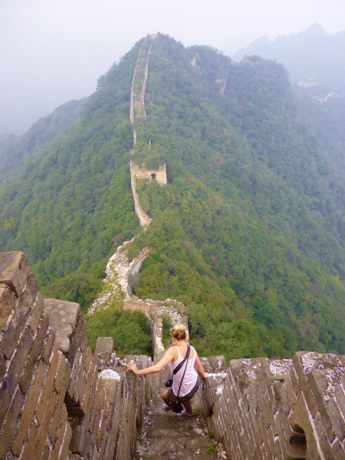 Girl hiking the Great Wall of China.