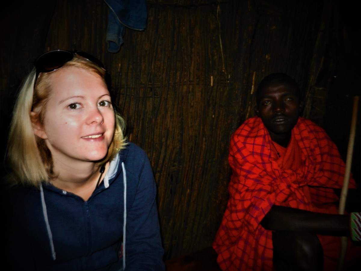 Woman and Masai Warrior in hut in Kenya