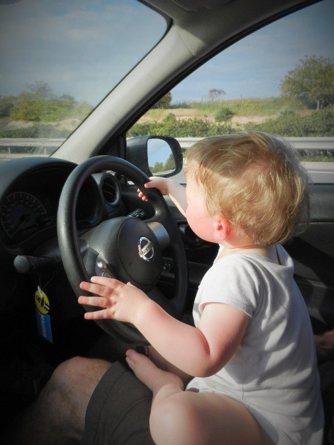 Toddler at steering wheel in Cyprus