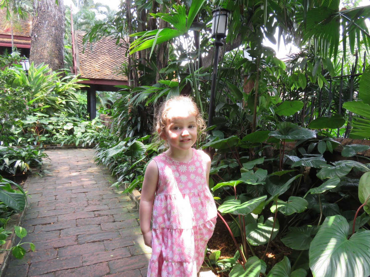 Girl in Jim Thompson garden in Bangkok, Thailand