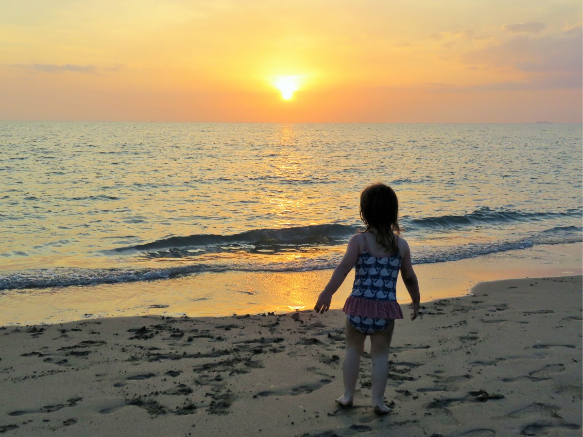 Girl watching sunset on Ko Lanta, Thailand