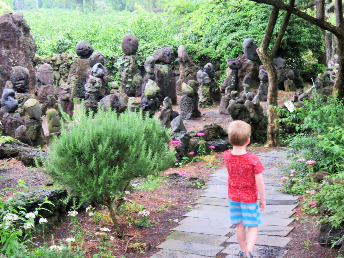boy in stone park Jeju Island