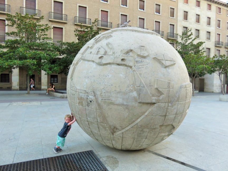 Spain with a toddler: toddler pushing globe