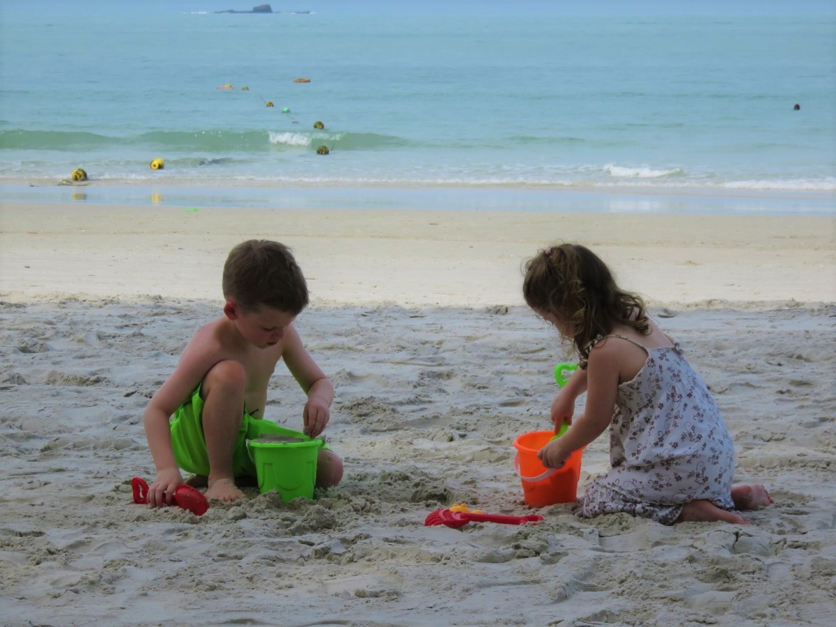 toddlers playing on beach in Langkawi