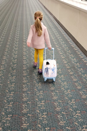 girl with carry-on luggage