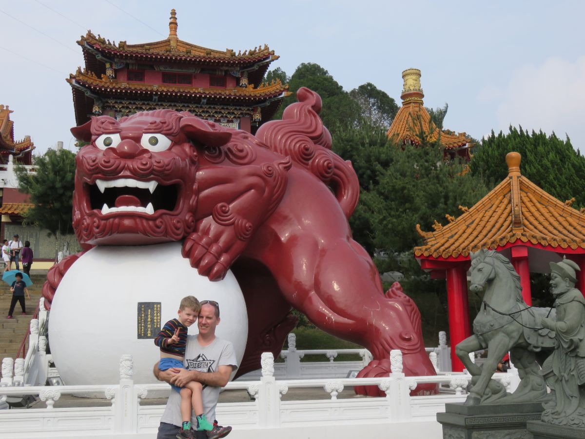 man and boy posing by dragin at Wenwu temple taiwan