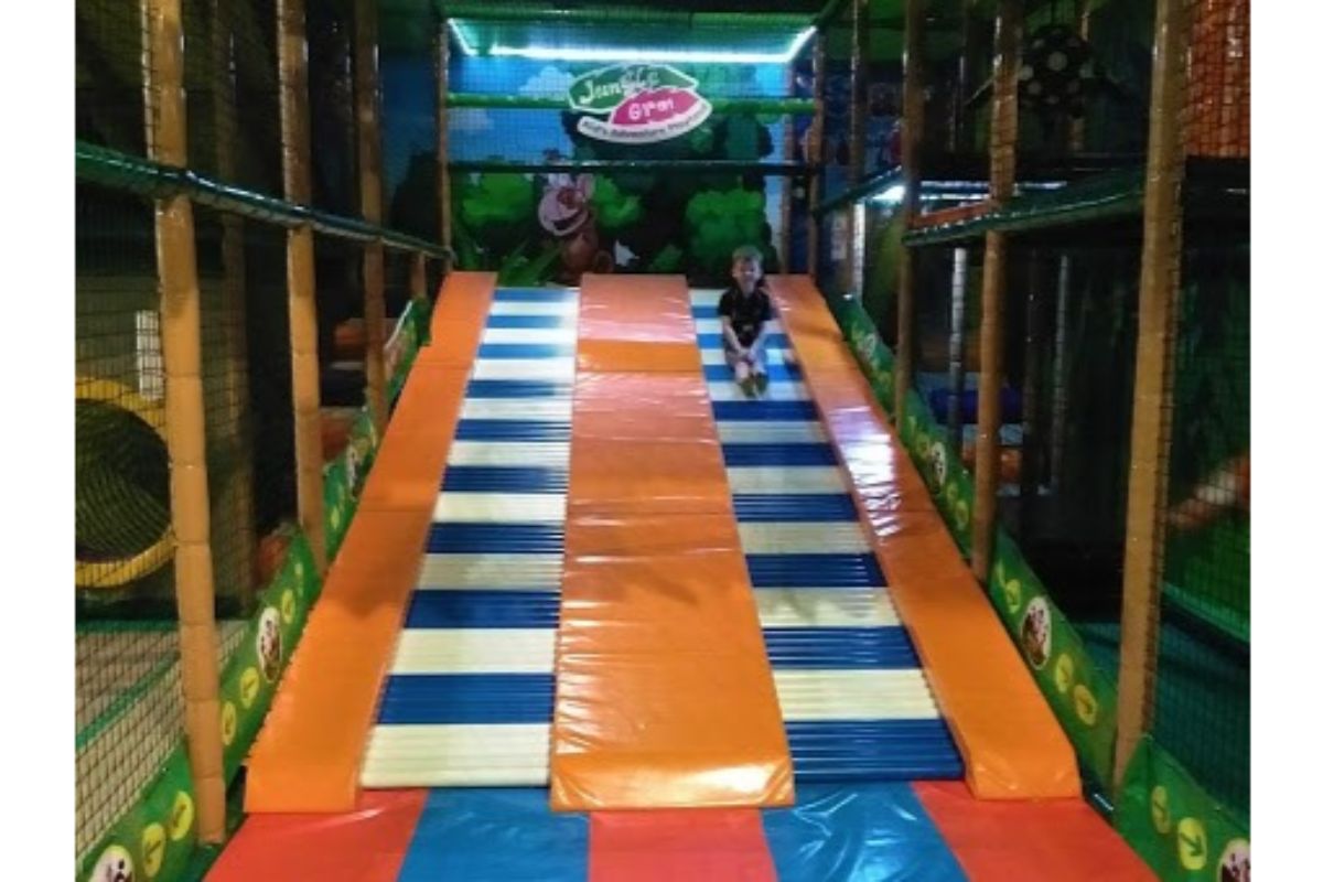 boy on slide at Jungle Gym indoor playground kl