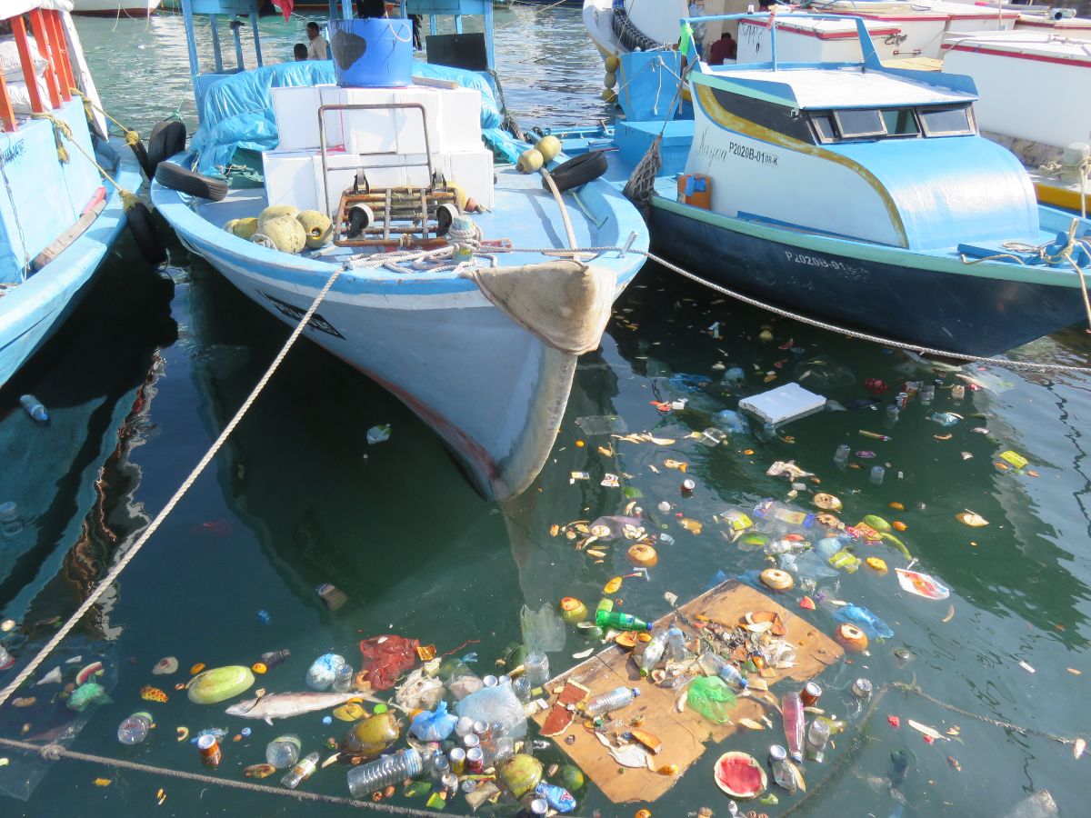 rubbish floating in the harbour in Male, the Maldives