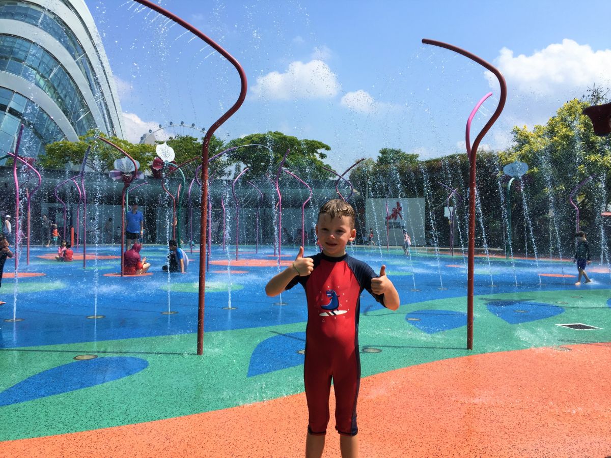 boy at splashpark in Singapore