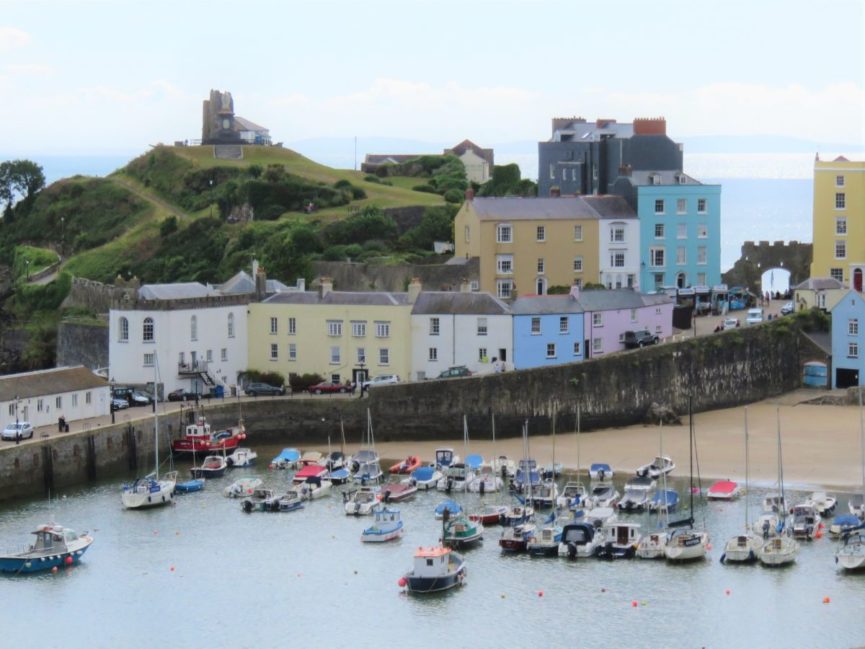 colourful houses lining the cliff above Harbour Beach in Tenby