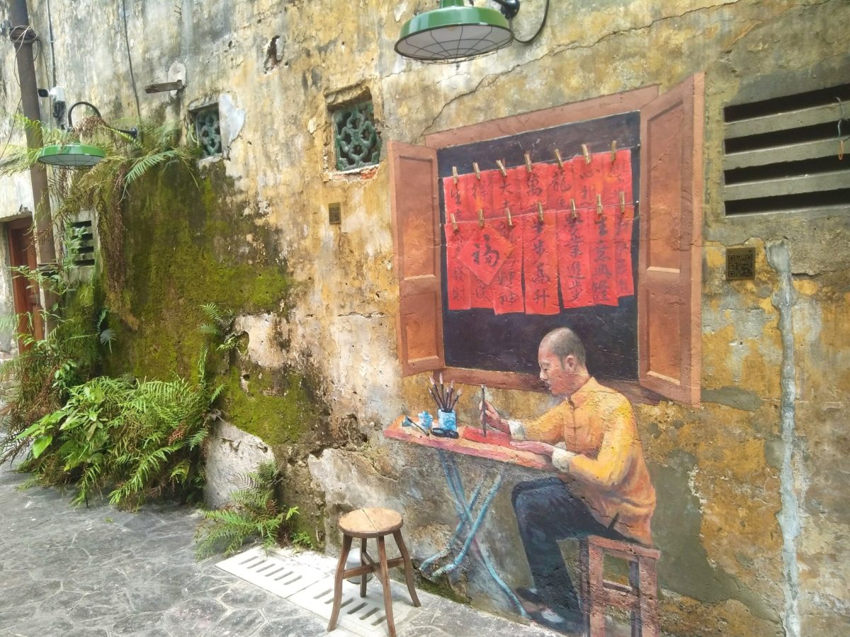 Kwai Chai Hong Alley, Chinatown - mural of man doing calligraphy
