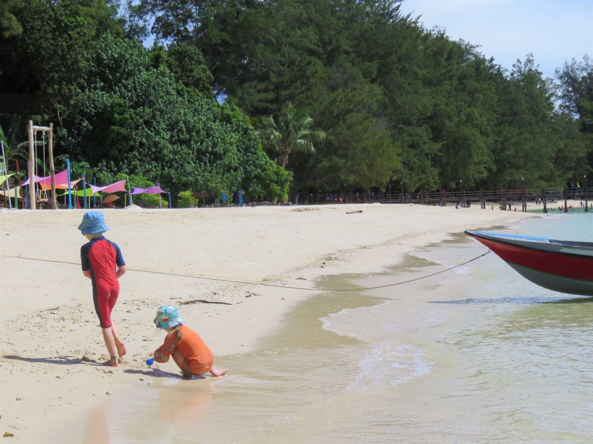 Children playing on beach in Tunku Abdul Rahman Park near Kota Kinabalu